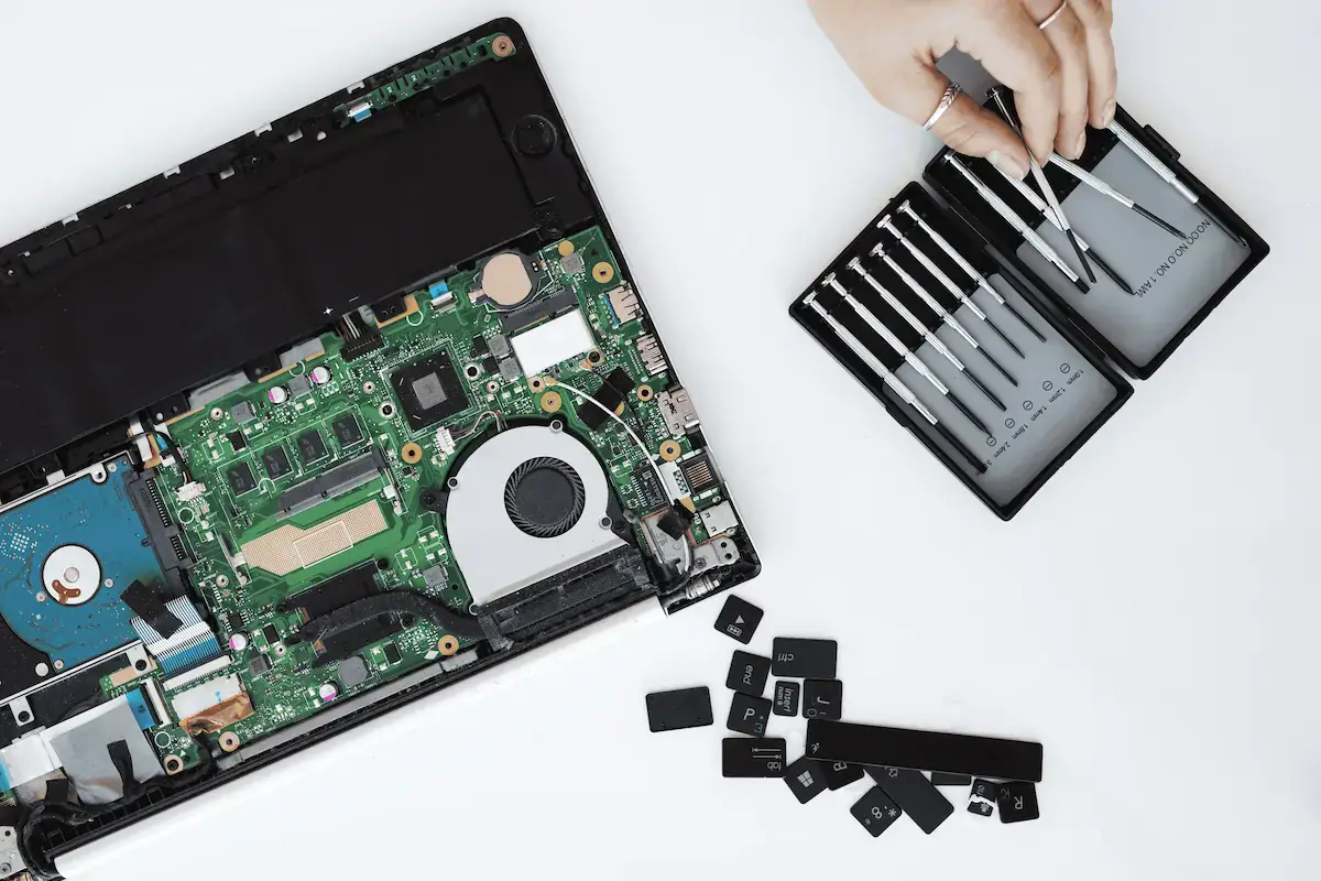 Technician performing electronic device repair